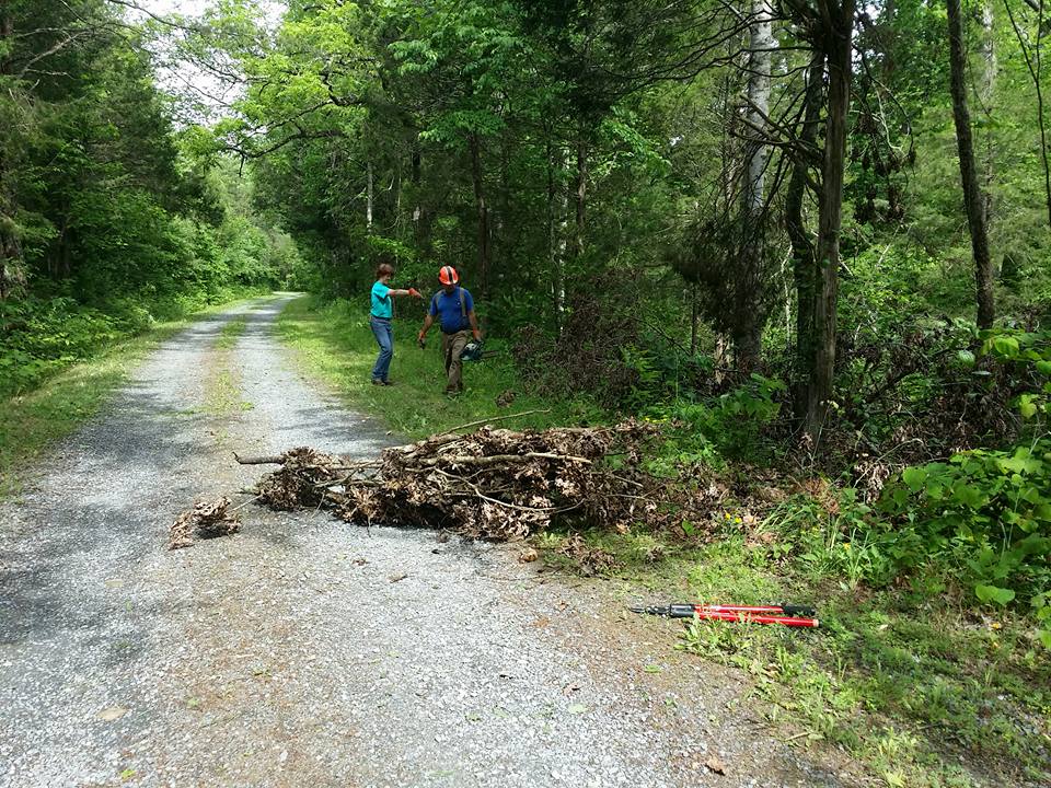 Wynne and Ray Waldron work on course maintance.
