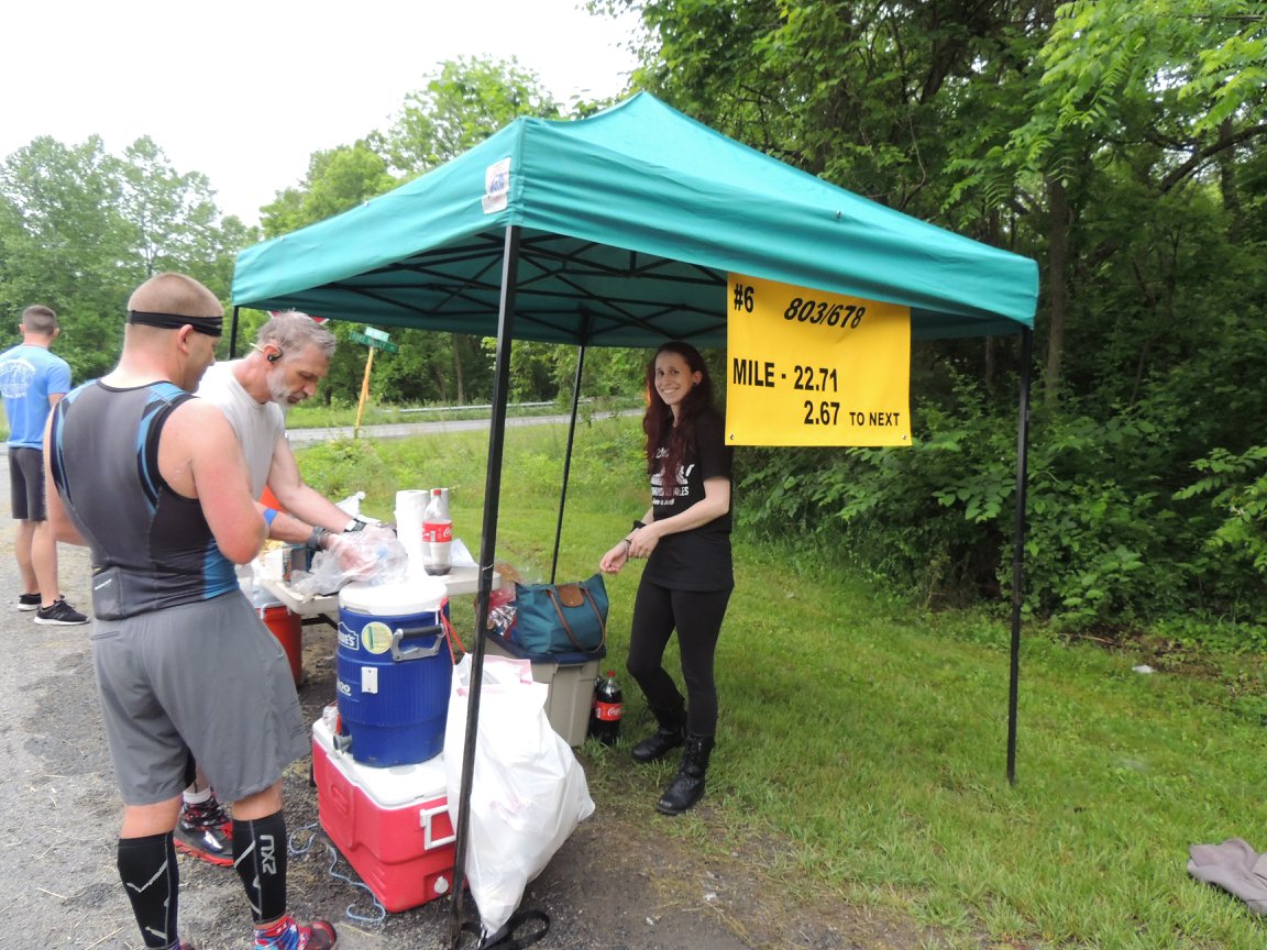 803 aid Station. Brock Webb and another runner receives aid. 