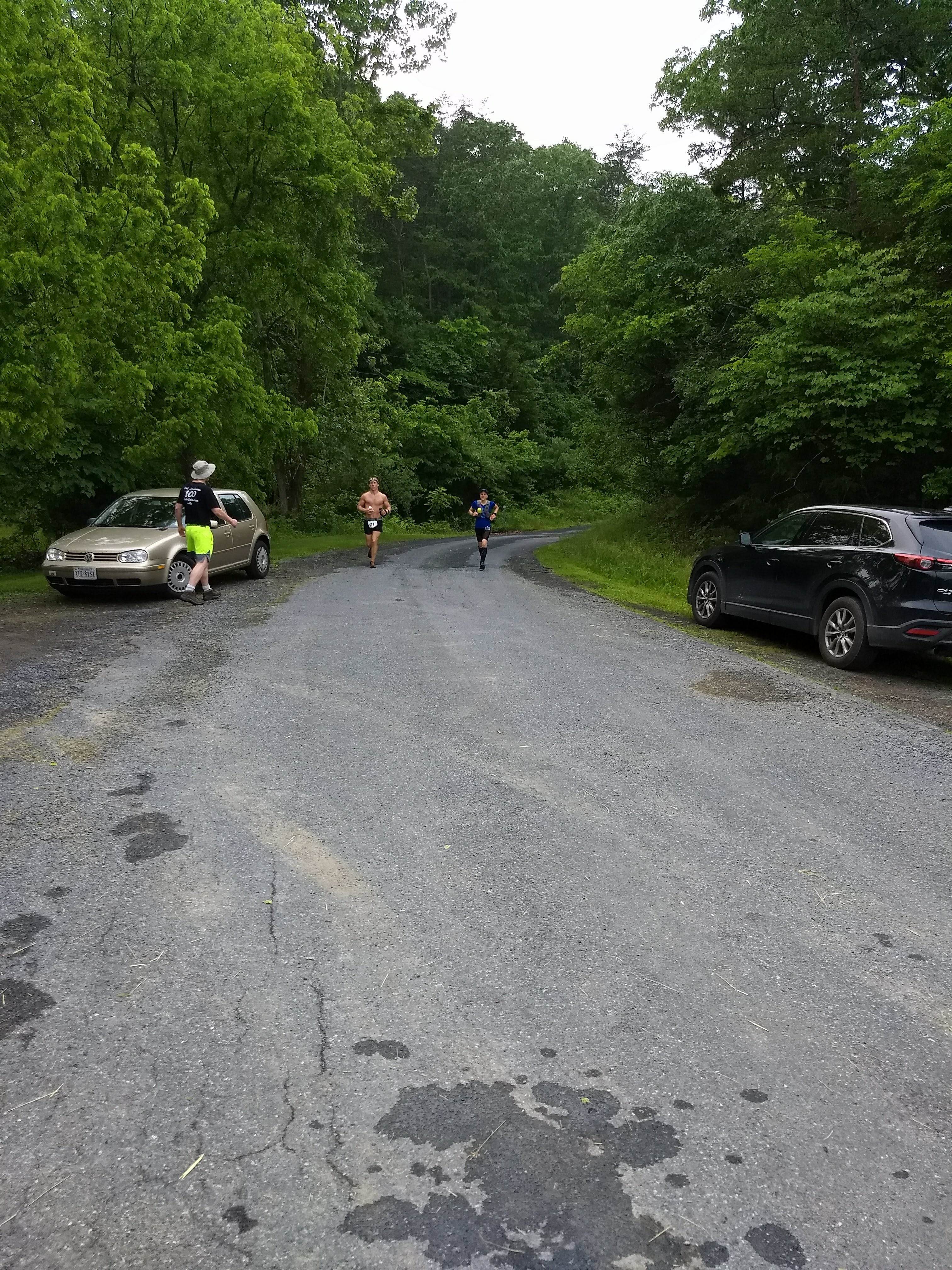 803 aid station. Volunteers proving aid to a runner.