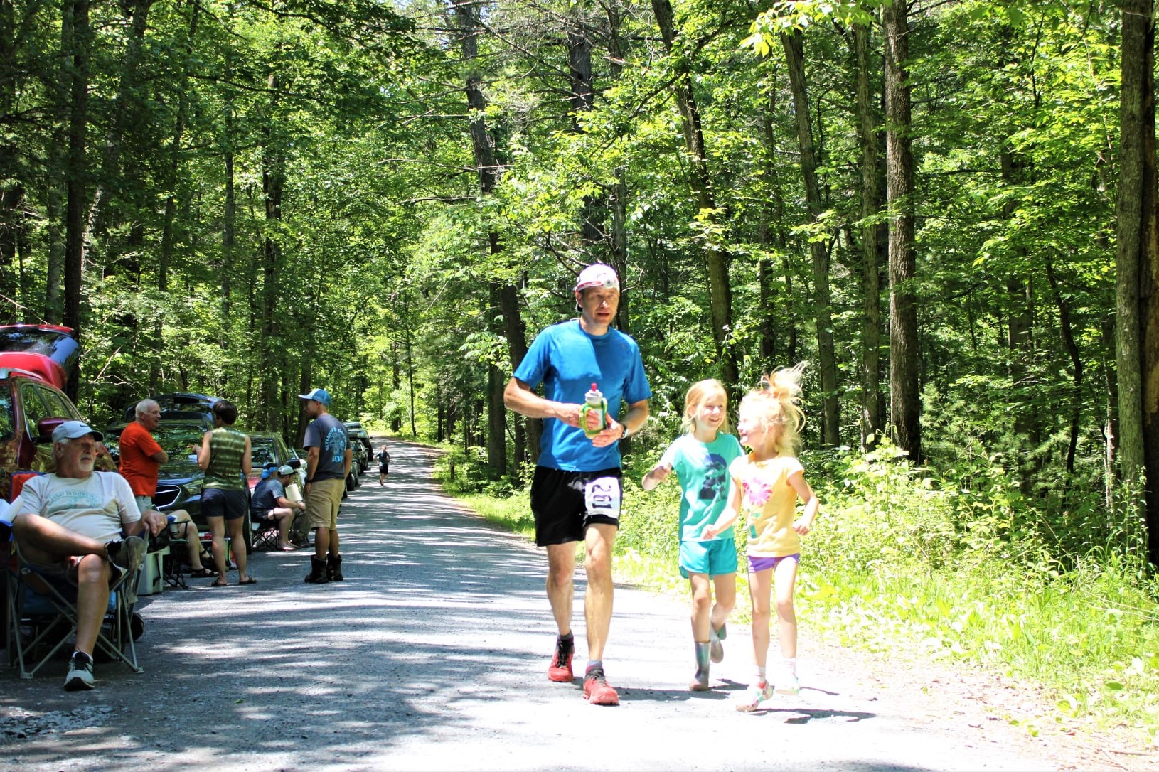 John Lehmann running with his children at 4-points. 