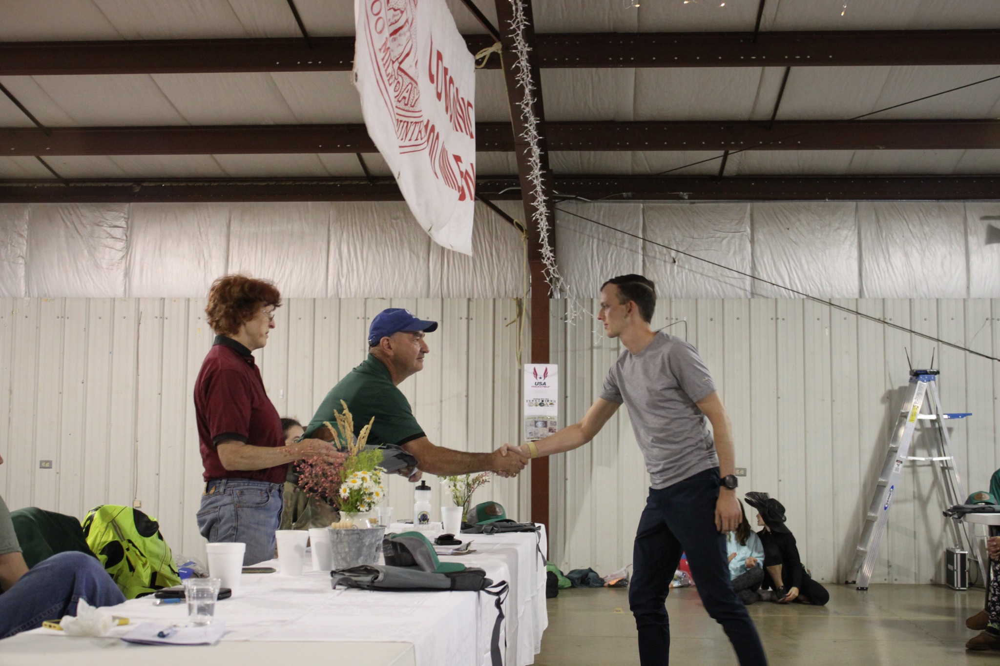 Andrew Palen, son of David Palen, recieves his buckle