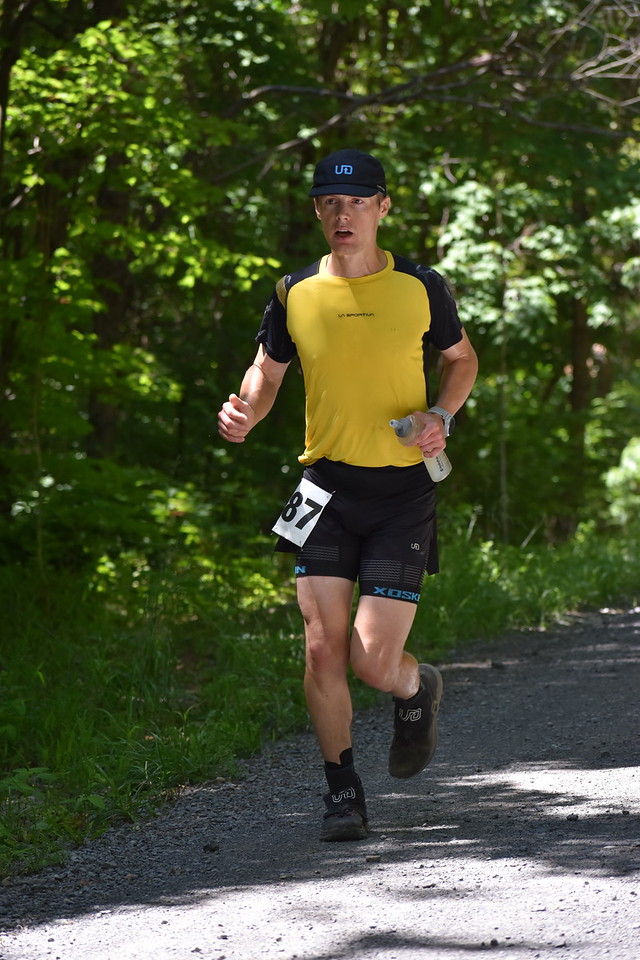 John Kelly running in yellow shirt and hat